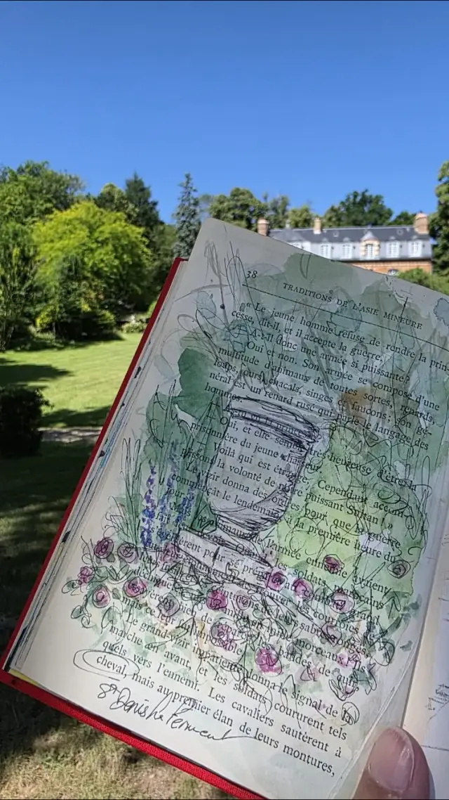Fête de la Peinture : une aquarelle achevée, tenue devant le paysage qui l'a inspirée
